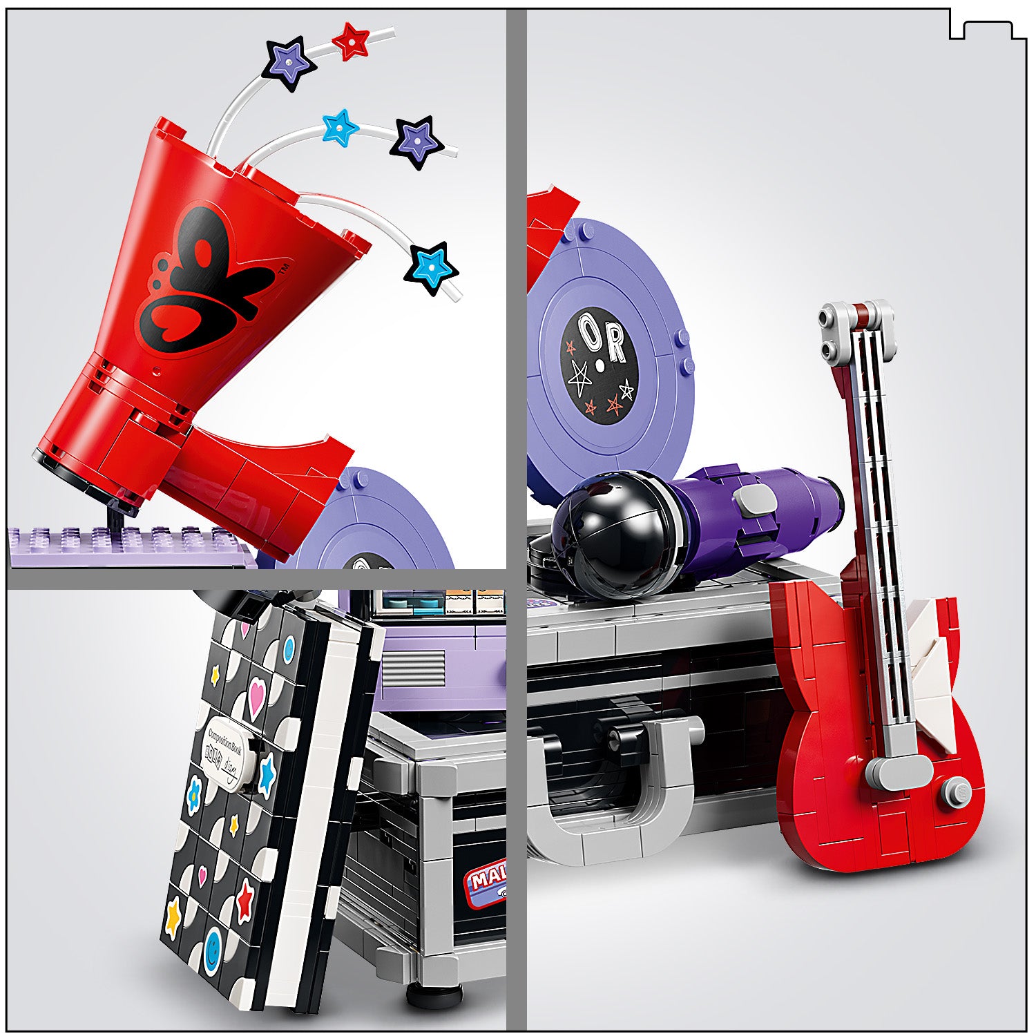 Nahaufnahme eines LEGO Sets mit einem roten Megafon mit schwarzem Schmetterlingsmotiv, einem roten E-Gitarrenmodell, einem Mikrofon und einem Notizbuch mit bunten Symbolen auf dem Cover.