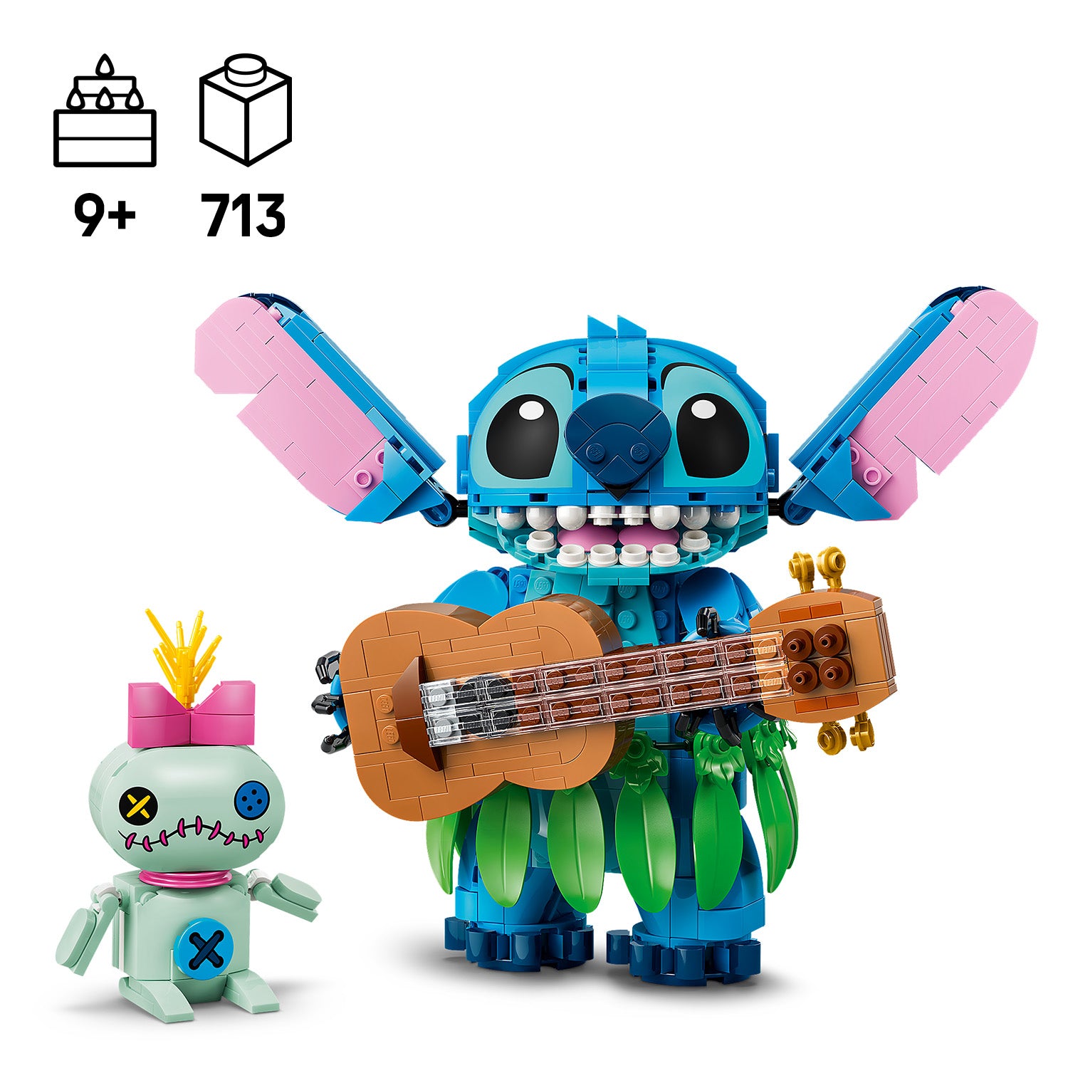Zwei LEGO Figuren, eine große blaue mit großen Ohren und einer braunen Gitarre, die andere kleiner und grün mit einem pinken Schleifchen und gestickten Augen.