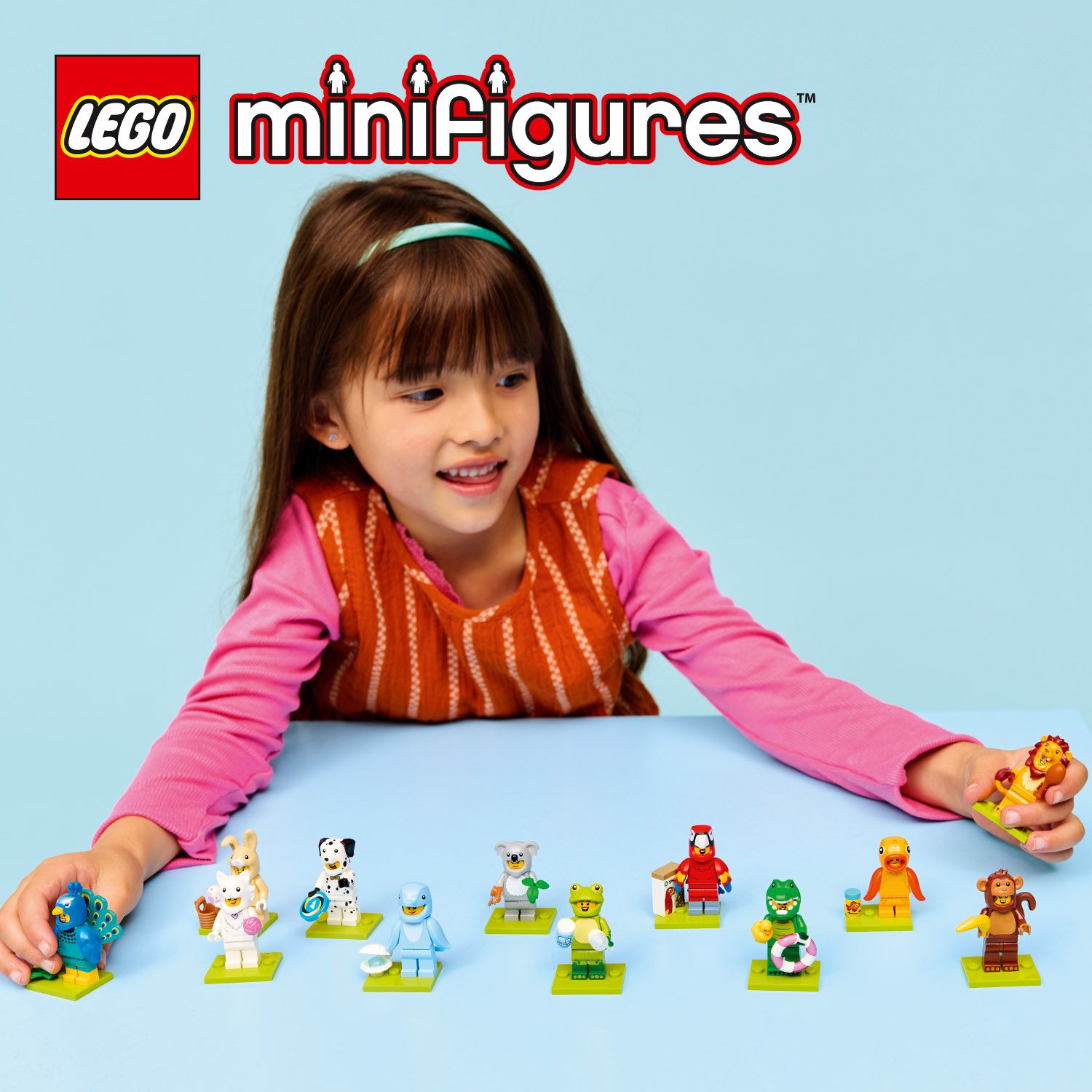 Themebutton Serie 28 Mädchen spielt mit LEGO Figuren